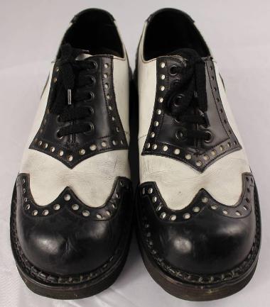 Black and white lace up leather shoes, commonly known as 